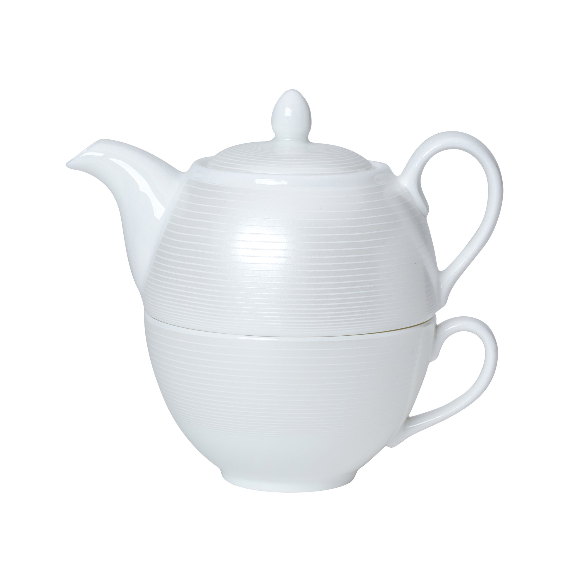 Weiße Teekanne mit Tasse kombiniert.