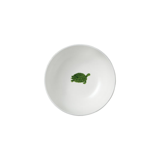 Weiße Schüssel mit grüner Schildkröte.