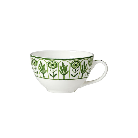 Weiße Tasse mit grünem Muster.