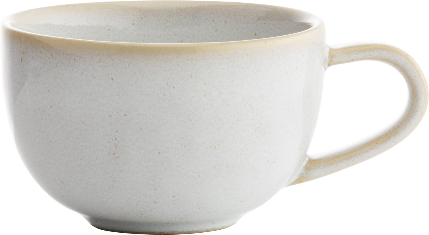 Weiße Tasse mit Henkel.