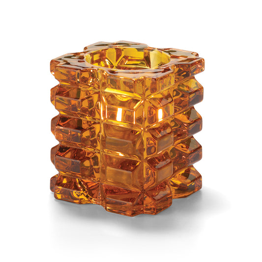 Orangefarbener, strukturierter Glasbehälter.
