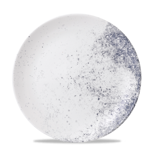 Weißer Teller mit blauen Sprenkeln.