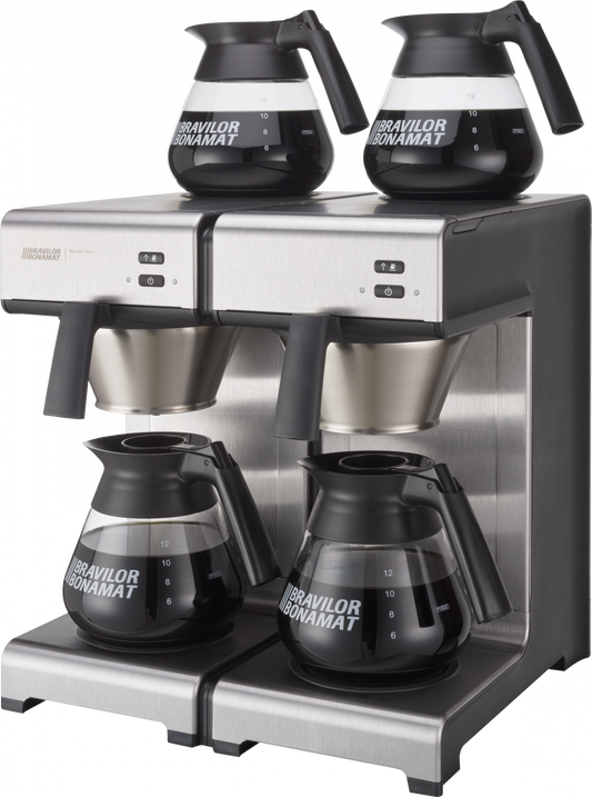 Kaffeemaschine mit vier Kannen.