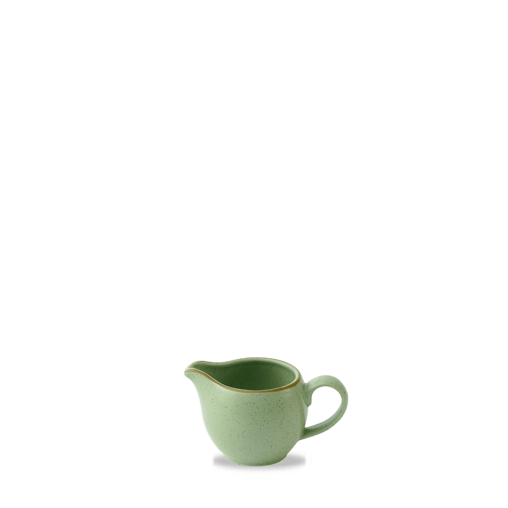 Grüne Kaffeekanne auf Tisch