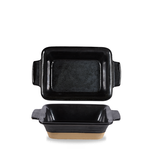 Zwei schwarze Auflaufformen, rechteckig.