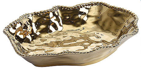 Goldene, wellige Servierschale.