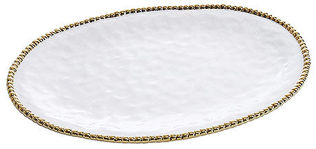 Ovaler Teller mit goldener Umrandung.