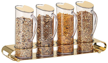 Vier Müsli-Spender auf Tablett.