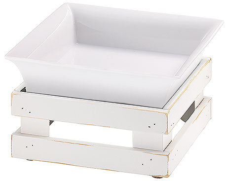 Weiße Schale auf Holzgestell.