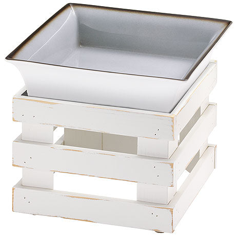 Weiße Schale auf Holzgestell.