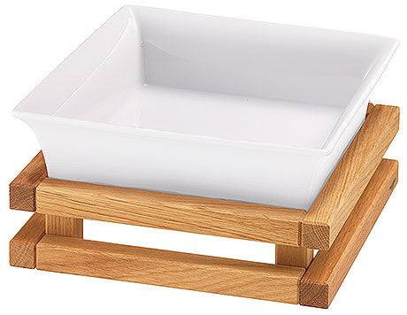 Weiße Schale auf Holzgestell.