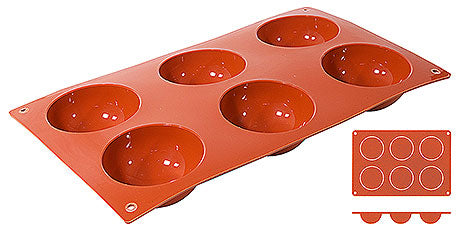 Rote Silikon-Backform mit Mulden.