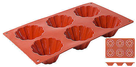 Rote Silikon-Backform mit Vertiefungen.