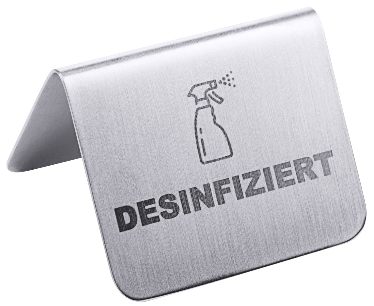 Metallschild mit "Desinfiziert"-Aufschrift.