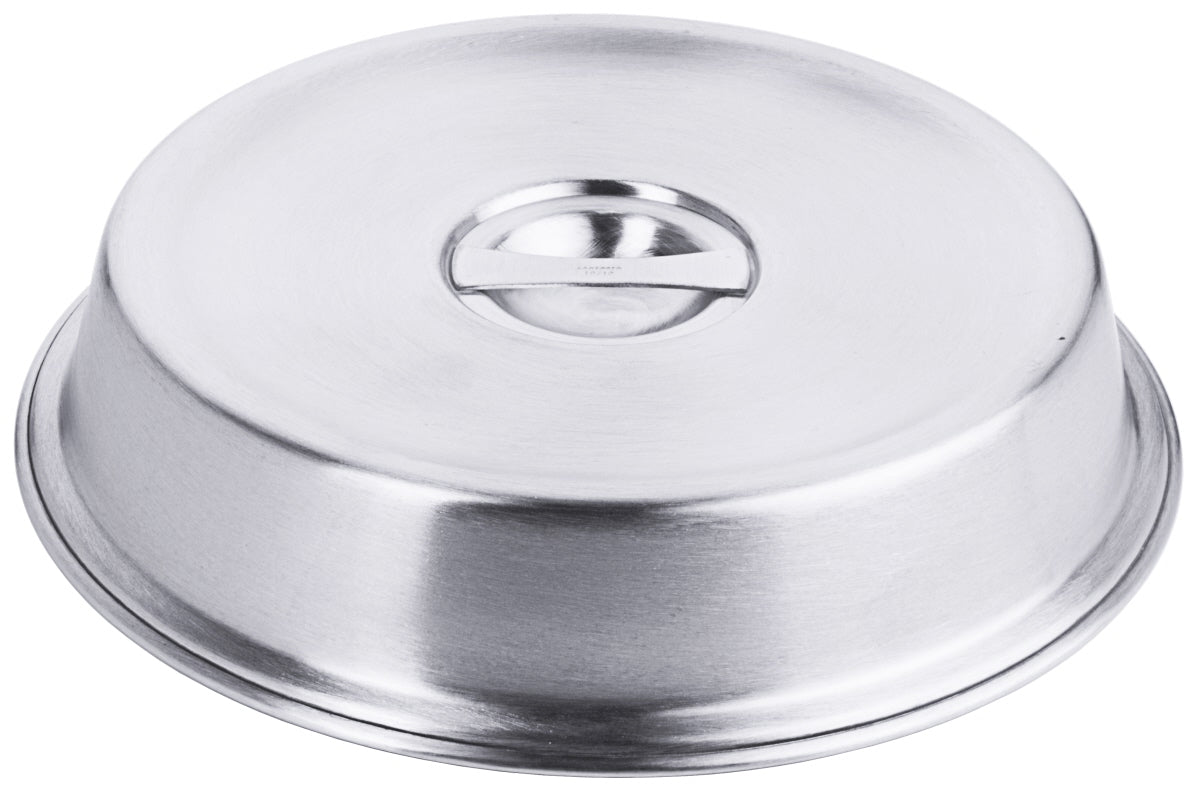 Metallene Speiseglocke auf Tisch.