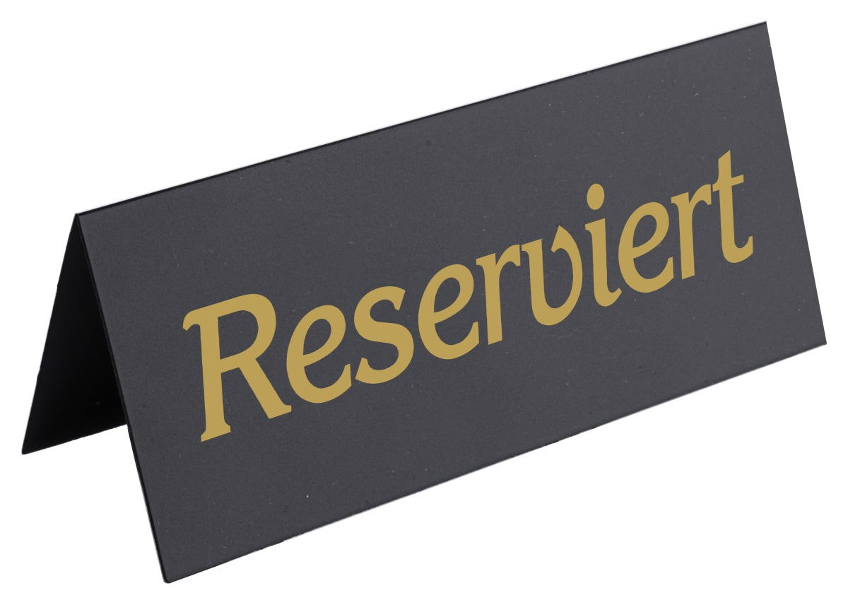 Reserviert-Schild auf Tisch.