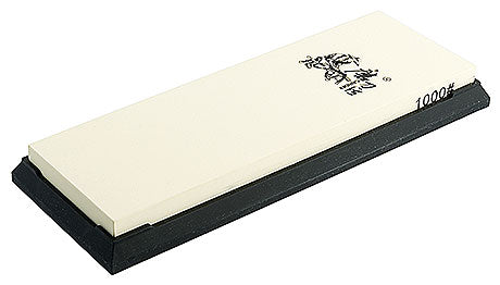 Wetzstein auf schwarzer Basis.