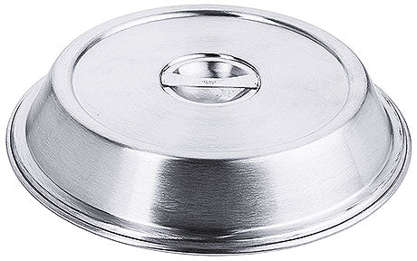 Metallene Speiseglocke auf Tisch.